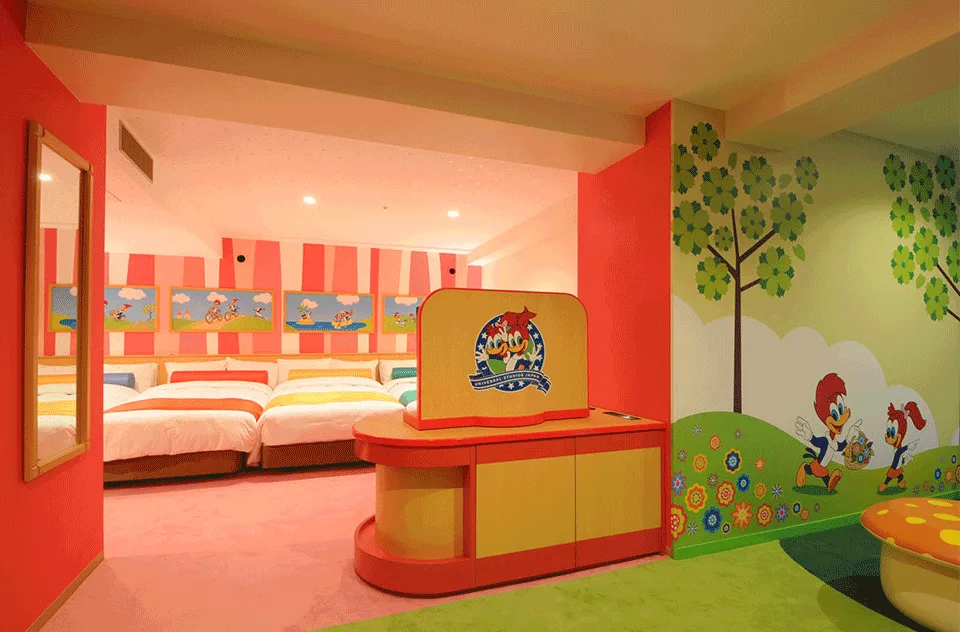 Living area of Woody Woodpecker suite with themed furniture and Universal Studios memorabilia