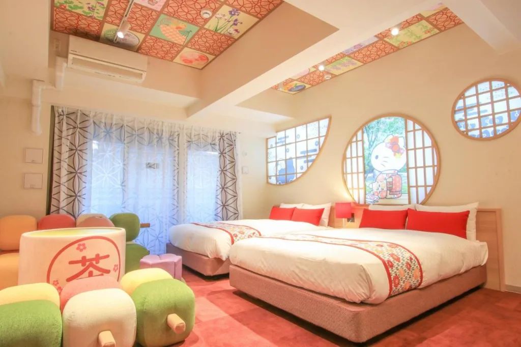 Hello Kitty themed hotel room at RESI STAY Kyoto featuring pink decor and character merchandise